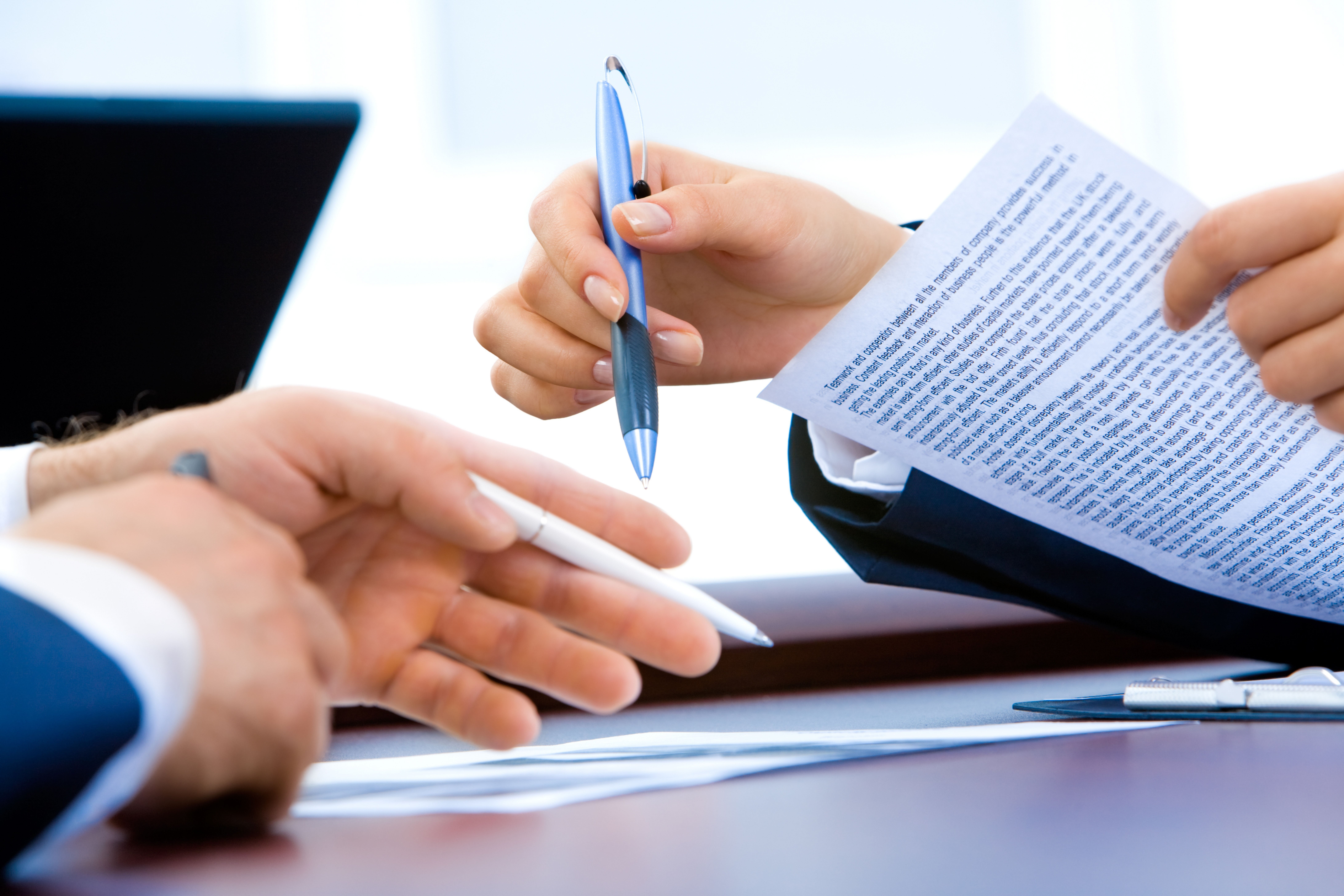 HR Consultants Glasgow reviewing employment contracts and legal paperwork.